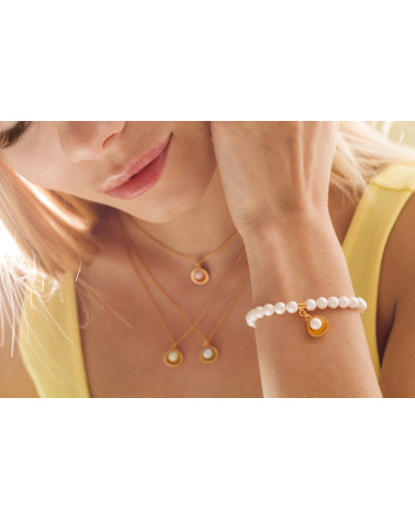 Srebrny naszyjnik z muszelką i perłą SWAROVSKI® CRYSTAL w kolorze Antique Brass